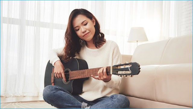 ielts students playing guitar
